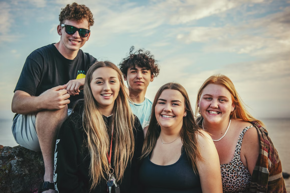 Group of teenagers by the beach.